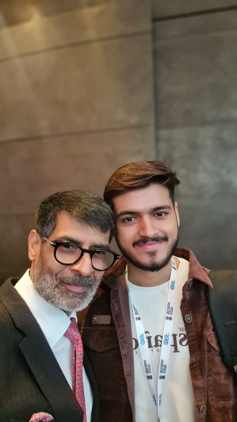 Akshat Mehrotra standing with the President of a prominent Think Tank.